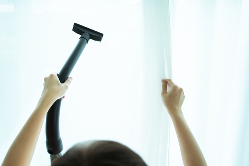 Housewife Vacuuming Curtain